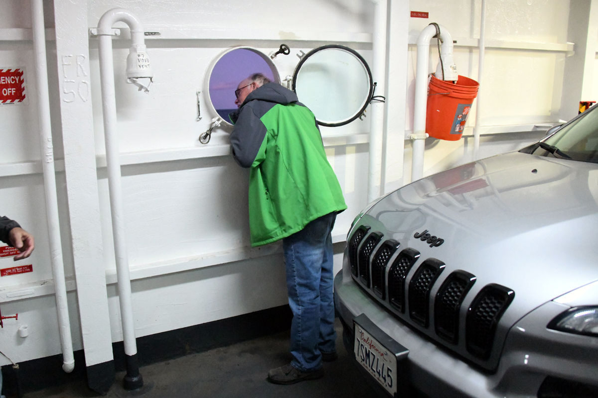 128 Ron Klute and others went to the lower deck to see the vehicles being transported back to Cape Cod..jpg